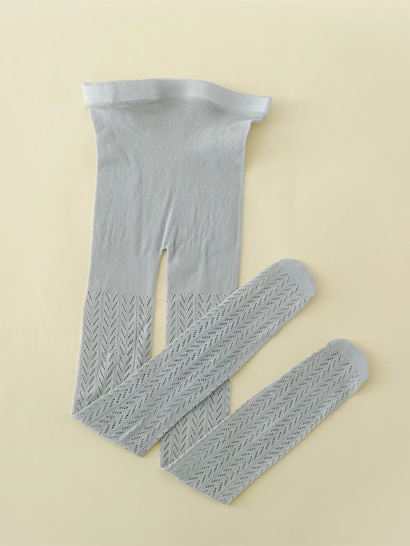 "Collants en maille fine et coton avec motif de poisson"